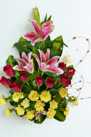 Red Roses, Pink Lilies & Yellow Carnations Premium Arrangement